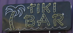 the sign for the Boardwalk Tiki Bar